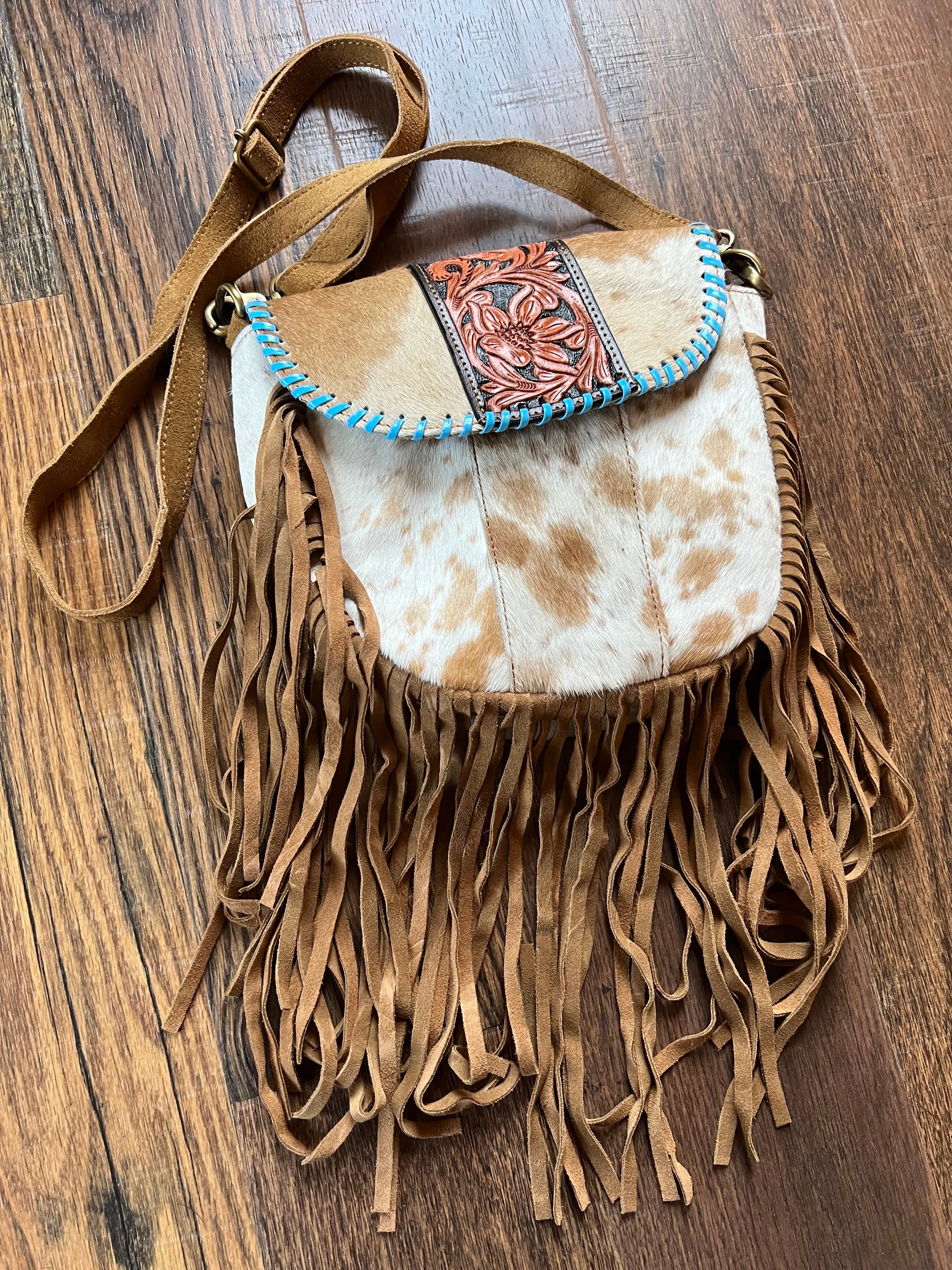 Leather Crossbody Bag with hair on cowhide, teal lacing and fringe